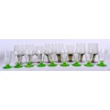 A SET OF NINE ART DECO GREEN BASE LIQUEUR GLASSES, together with eight smokey glasses. Deco set 8.5