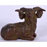 A JAPANESE BRONZE OKIMONO IN THE FORM OF A SEATED RAM, signed to base. 6.25 cm wide.