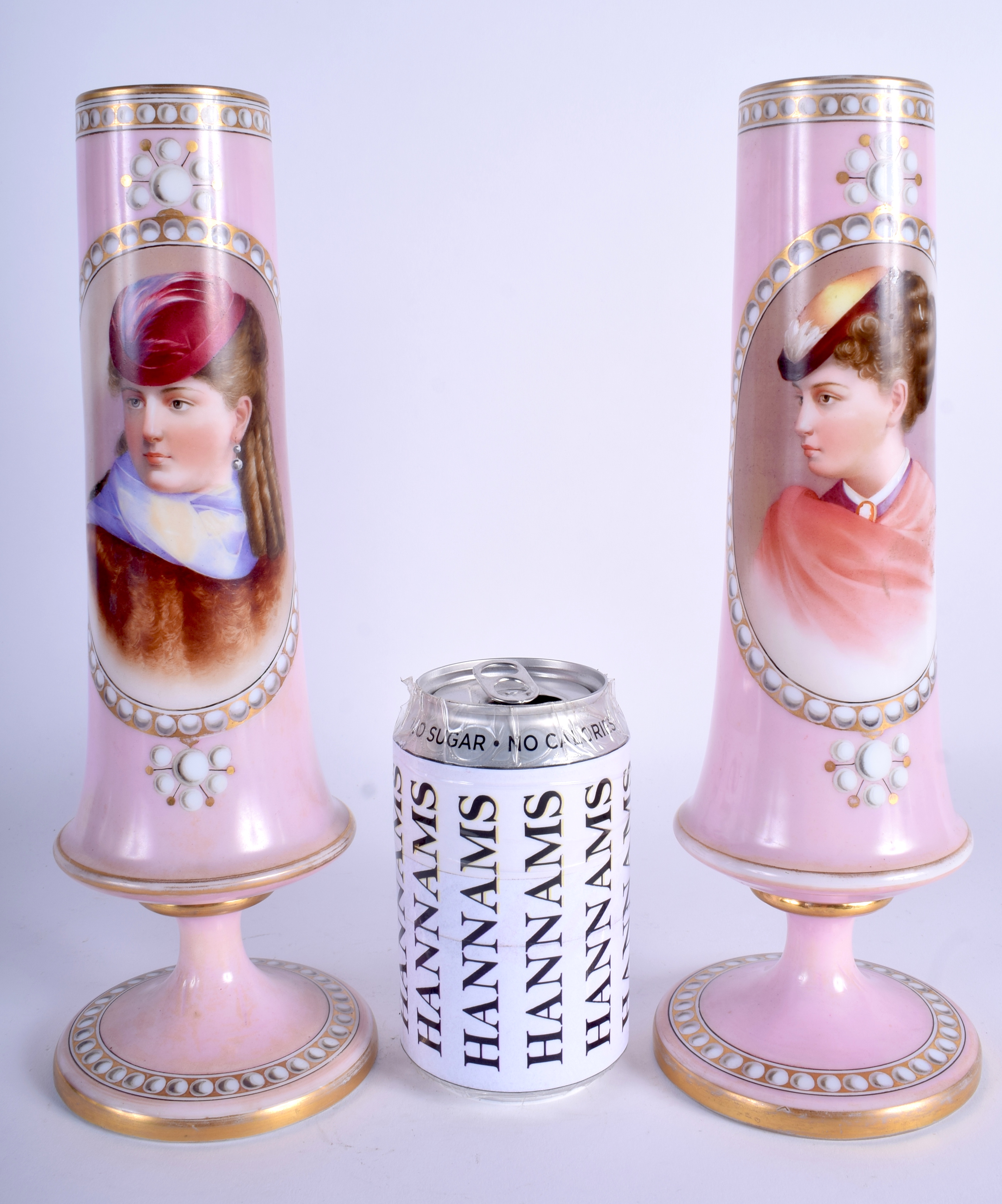 A PAIR OF ANTIQUE CONTINENTAL PINK OPALINE GLASS VASES depicting portraits of females. 28 cm high.