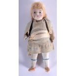 AN UNUSUAL EARLY 20TH CENTURY EUROPEAN PORCELAIN DOLL with original clothing and fully porcelain li