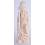 AN EARLY 20TH CENTURY CHINESE CARVED IVORY FIGURE OF SAGE modelled holding a peach. 13 cm high.