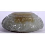 AN EARLY 20TH CENTURY CHINESE ISLAMIC MARKET GREEN JADE BRUSH WASHER, carved with flowering vines.