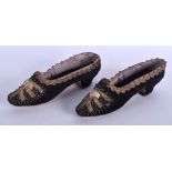 A PAIR OF EARLY 19TH CENTURY EMBROIDERED SHOES. 19 cm long.