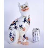 A 19TH CENTURY CONTINENTAL POTTERY FIGURE OF A CAT possibly by Emile Galle. 35 cm x 15 cm.