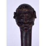 AN EARLY 20TH CENTURY AFRICAN TRIBAL WALKING CANE OR STAFF, carved with a figure and the terminal f