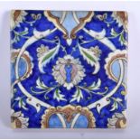 A 19TH CENTURY MIDDLE EASTERN PALESTINE IZNIK SQUARE TILE painted with flowers. 16.5 cm square.