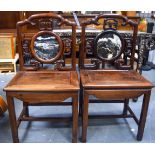 AN UNUSUAL PAIR OF 19TH CENTURY CHINESE HARDWOOD CHAIRS with dream stone inset panels, with Greek K