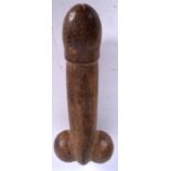 A CARVED STONE PENIS PENDANT, formed with a tapering shaft and shrunken testicles. 20 cm long.