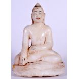 A NEPALESE CARVED MARBLE BUDDHA, polychrome remnants. 20.5 cm high.
