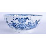 A 18TH CENTURY LIVERPOOL BOWL painted in blue with a fence, bamboo and chrysanthemum. 18.5 cm wide.