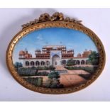 AN EARLY 20TH CENTURY INDIAN PAINTED IVORY MINIATURE painted with a temple scene with numerous figu