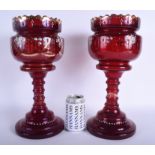 A PAIR OF ANTIQUE BOHEMIAN CRANBERRY GLASS LUSTRES. 36 cm high.