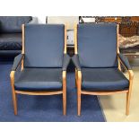 A STYLISH PAIR OF HEALS CHAIRS, formed with black leather upholstery. 88 cm x 67 cm.