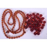 A COLLECTION OF CHERRY AMBER BEADS, together with an amber necklace. Necklace 114 cm long and total