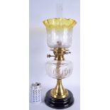 A LARGE EDWARDIAN CLEAR YELLOW OIL LAMP. 48 cm high not inc frame.