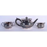 A MATCHED THREE PIECE SILVER TEASET. London 1882 to 1885. 25 oz. 22 cm wide. (3)