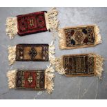 FIVE PERSIAN RUG SAMPLES, decorated with motifs. Largest 25 cm long. (5)