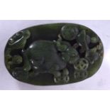 A CHINESE SPINACH JADE BOULDER PENDANT, carved with animals and lingzhi fungus. 7 cm long.