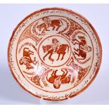 A PERSIAN POTTERY BOWL, decorated a figures on horseback and a calligraphy border. 26.5 cm wide.