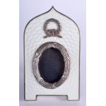 A CONTINENTAL SILVER AND ENAMEL PHOTOGRAPH FRAME with neo classical overlaid swags. 6 cm x 9 cm.
