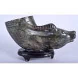 AN EARLY 20TH CENTURY CHINESE CARVED GREEN RHYTON LIBATION CUP in the form of an animals head. 20 c