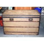 A LARGE VINTAGE LOUIS VUITTON TRAVELLING TRUNK with wooden strap banding, with internal label. 70 c