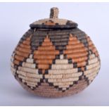 AN AFRICAN TRIBAL ZULU WICKER STORAGE JAR AND COVER. 18 cm x 18 cm.