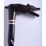 AN ANTIQUE EBONY AND IVORY BEAST CANE. 98 cm long.