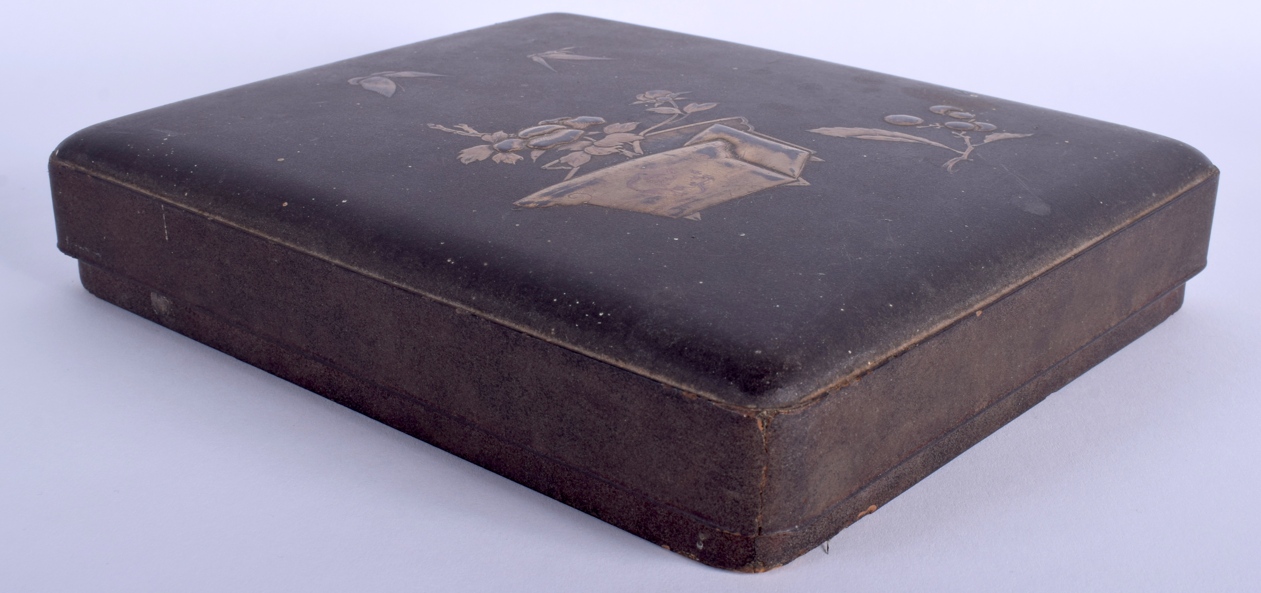 A 19TH CENTURY JAPANESE MEIJI PERIOD BLACK LACQUER BOX AND COVER decorated with a gilt jardinière.