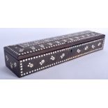 A 19TH CENTURY ANGLO INDIAN IVORY INLAID HARDWOOD BOX decorated with swirls and dots. 32 cm x 8 cm.