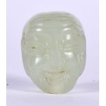 AN EARLY 20TH CENTURY CHINESE GREEN JADE TOGGLE IN THE FORM OF BUDDHA, modelled grinning. 2.75 cm.