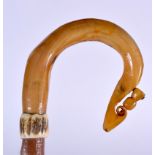 A SCOTTISH RAMS HORN WALKING STICK BY JOHN RENNIE OF TORPHICEN, formed with a hazel shaft. 89.5 cm