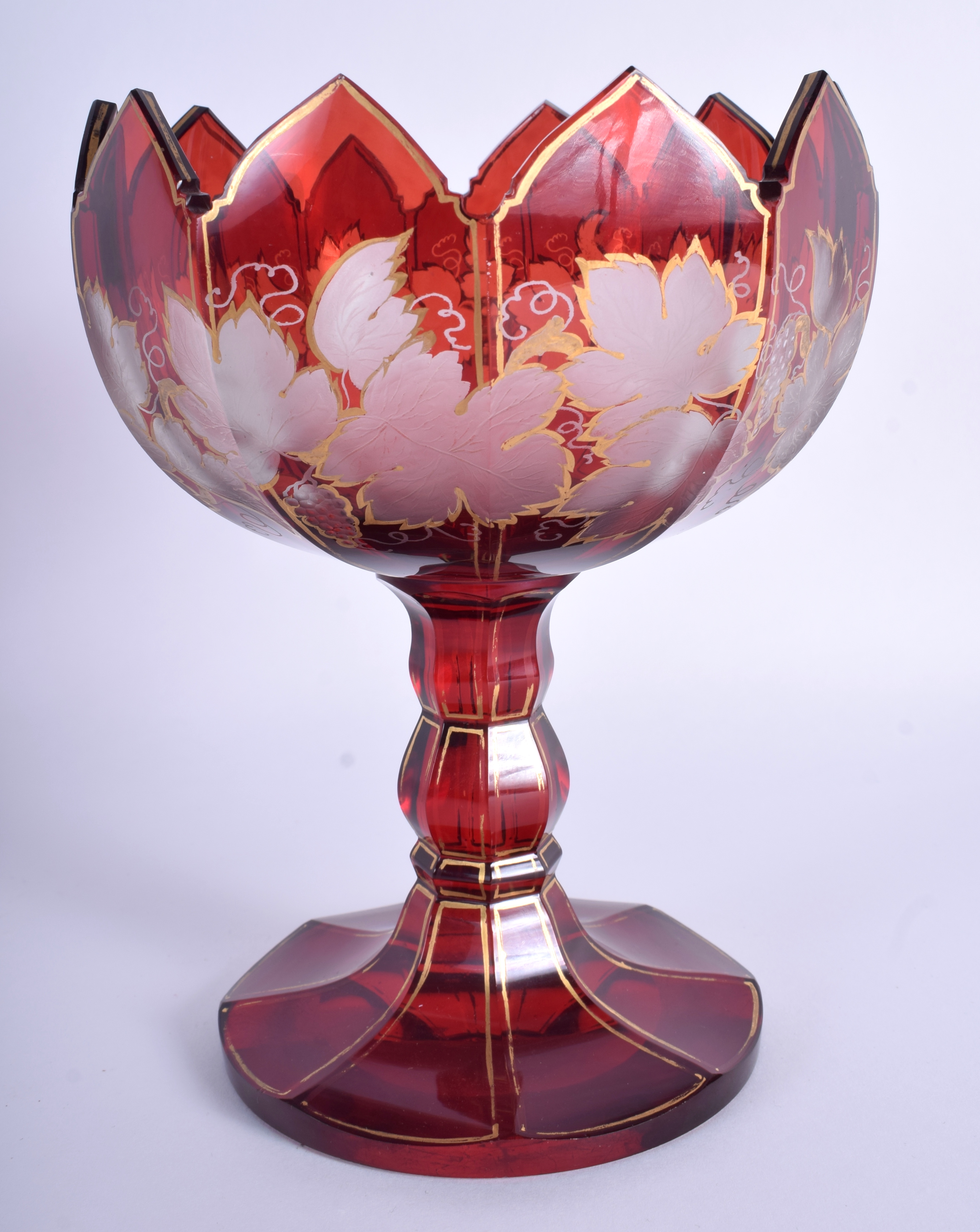 A 19TH CENTURY BOHEMIAN CRANBERRY GLASS COMPORT. 19 cm high.