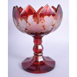 A 19TH CENTURY BOHEMIAN CRANBERRY GLASS COMPORT. 19 cm high.