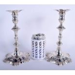 A PAIR OF 18TH CENTURY ENGLISH ARMORIAL SILVER CANDLESTICKS moulded with acanthus. London 1751. 41.