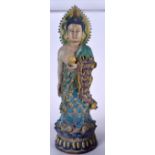 A LARGE CHINESE SANCAI POTTERY BUDDHA, modelled standing holding a lotus flower. 58 cm high.