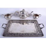 A FINE 19TH CENTURY INDIAN SILVER AND IVORY TWIN HANDLED TRAY Bombay, with matching three piece sil