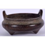 A MINIATURE CHINESE BRONZE CENSER, formed with loop handles, signed. 5.5 cm wide.