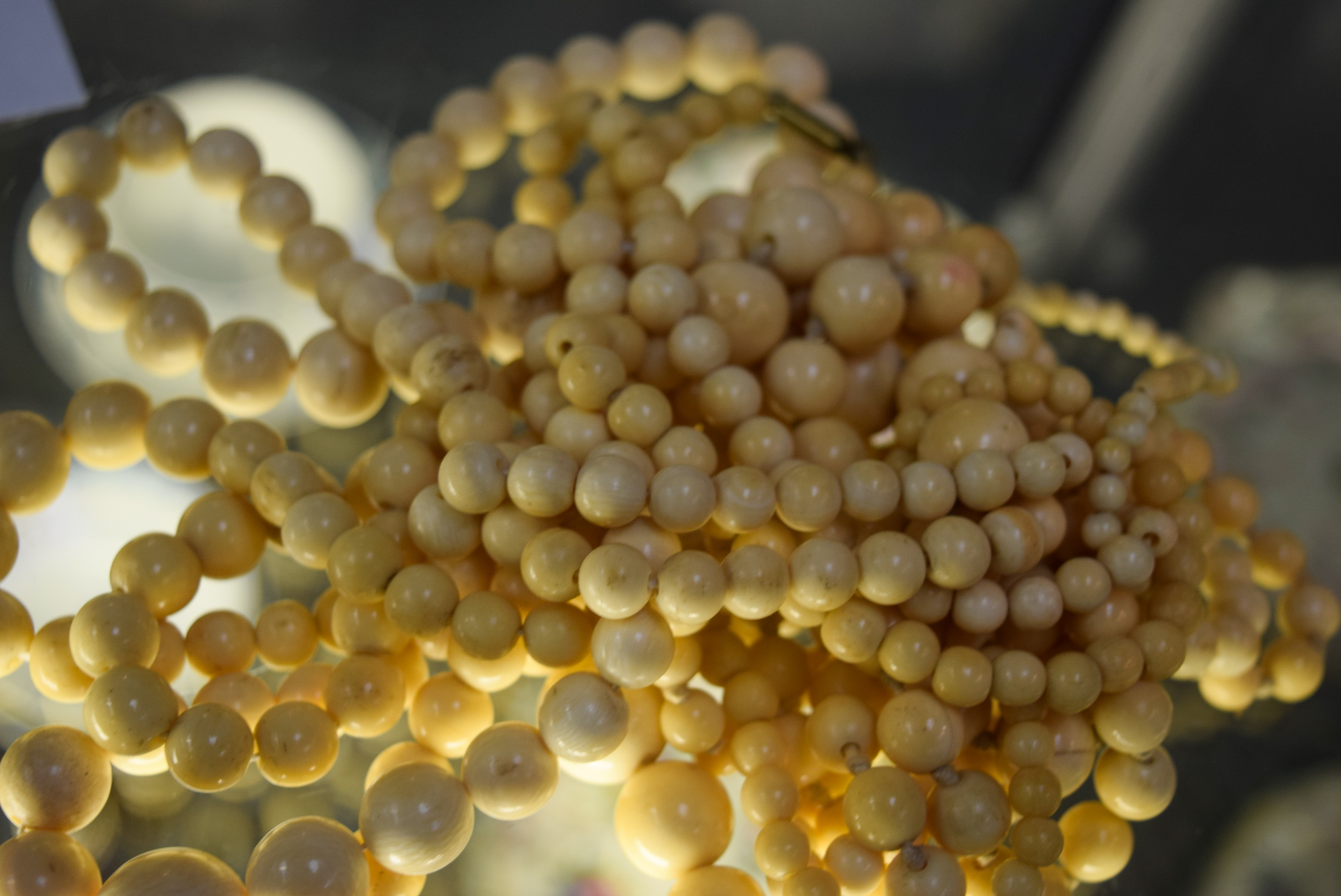 FIVE ANTIQUE IVORY NECKLACES, formed with spherical beads. Longest 102 cm. (5) - Image 2 of 3