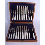 A CASED SET OF ANTIQUE SILVER AND MOTHER OF PEARL CAKE KNIVES AND FORKS. Sheffield 1909.