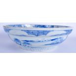 A LARGE 18TH/19TH CENTURY JAPANESE EDO PERIOD BLUE AND WHITE BOWL painted with landscapes. 34 cm di