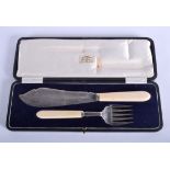 A PAIR OF SILVER AND IVORY FISH SLICE AND FORK. Sheffield 1928. 21 cm long.
