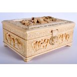 A LARGE EARLY 20TH CENTURY CHINESE CARVED IVORY CASKET Late Qing, modelled with figures within land