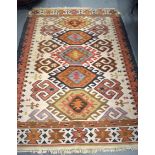 AN ANTIQUE KONYA HOTAMIS KILIM RUG, decorated with motifs. 183 cm x 125 cm.