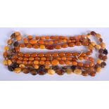 THREE VINTAGE AMBER BRACELETS together with an amber necklace. 37 grams. (4)