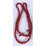 A LONG STRAND CHINESE AGATE BEAD NECKLACE, carved with geometric symbols. 142 cm long.