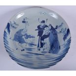 A LARGE CHINESE BLUE AND WHITE PORCELAIN CHARGER, painted with immortals in a landscape. 41 cm wide