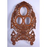 A RARE LARGE 19TH CENTURY INDIAN CARVED SANDALWOOD FRAME formed with flowers and vines. 21 cm x 34