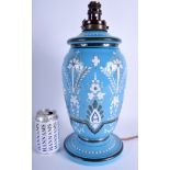 A LARGE VICTORIAN WHITE ENAMELLED OPALINE GLASS OIL LAMP converted to a lamp, painted with flowers.