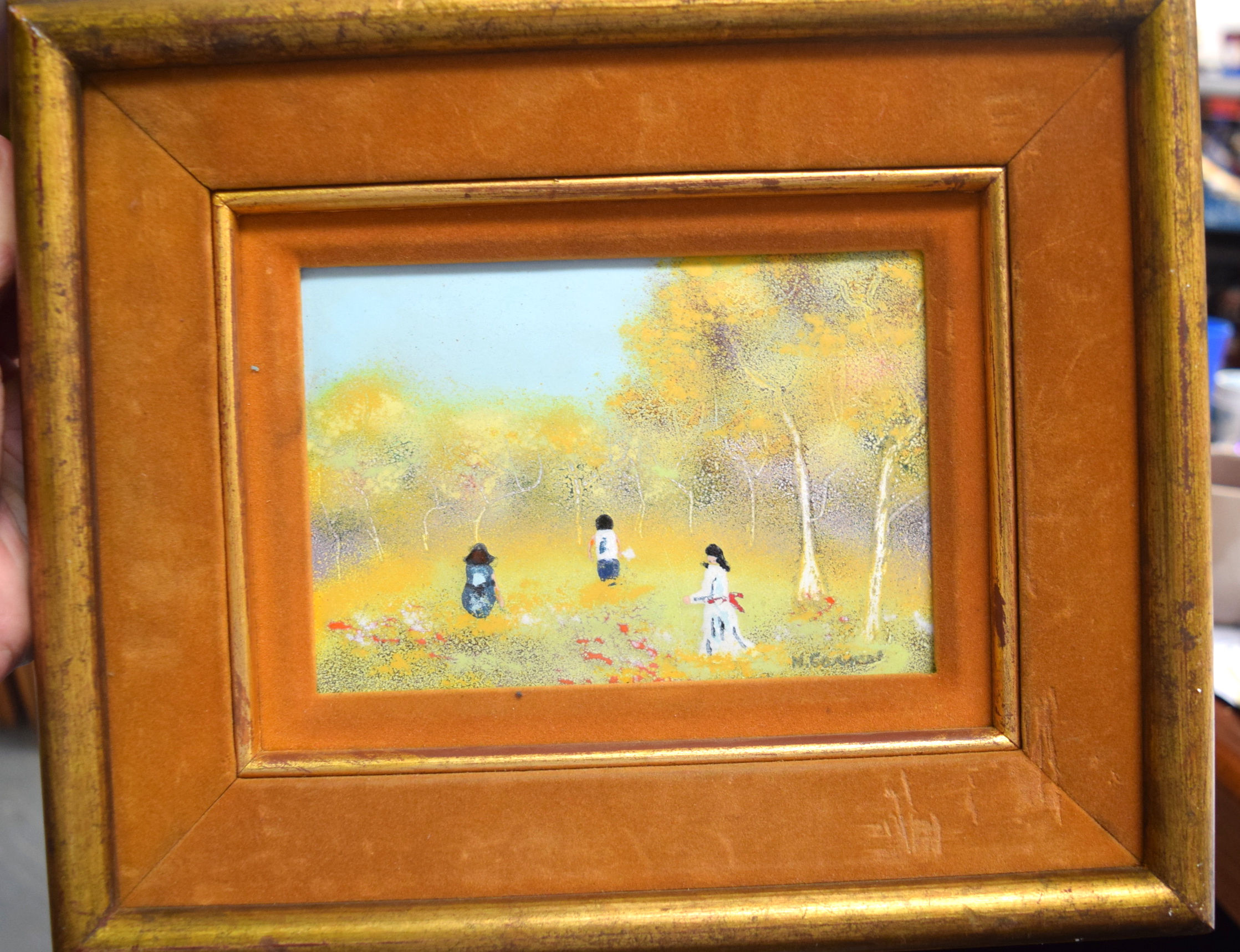 M GOMES (20th century) FRAMED OIL ON ENAMEL, figures in a landscape, signed. 11 cm x 16 cm. - Image 2 of 3